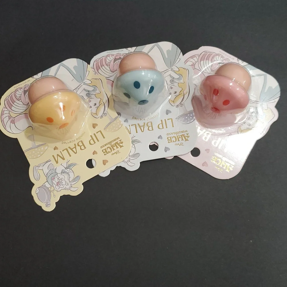 Disney's Alice in Wonderland raspberry vanilla and coconut scented lip balms new